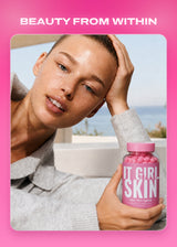 Woman holding a pink It Girl Skin gummy bottle in a beauty campaign photograph.