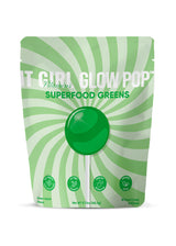 Green striped It Girl Glow Pop Superfood Greens pouch on a white background.
